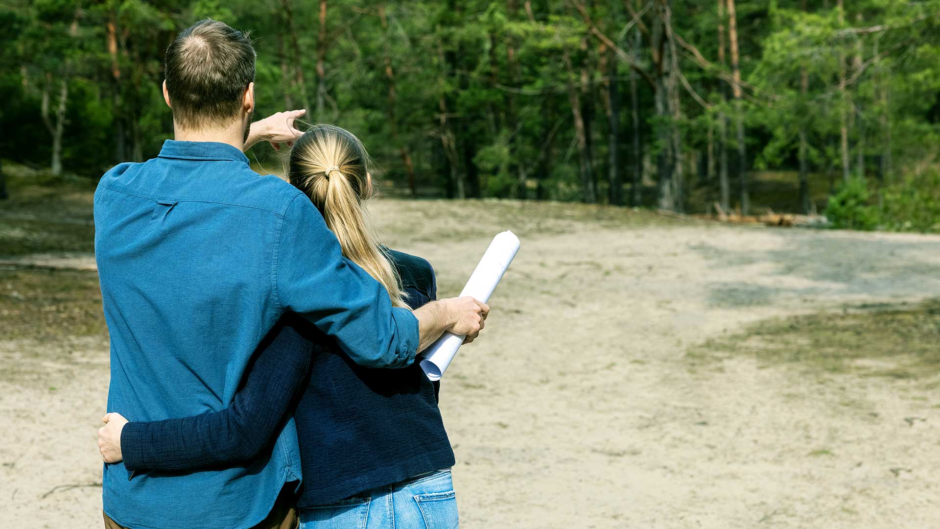 Couple reviews their new lot of land